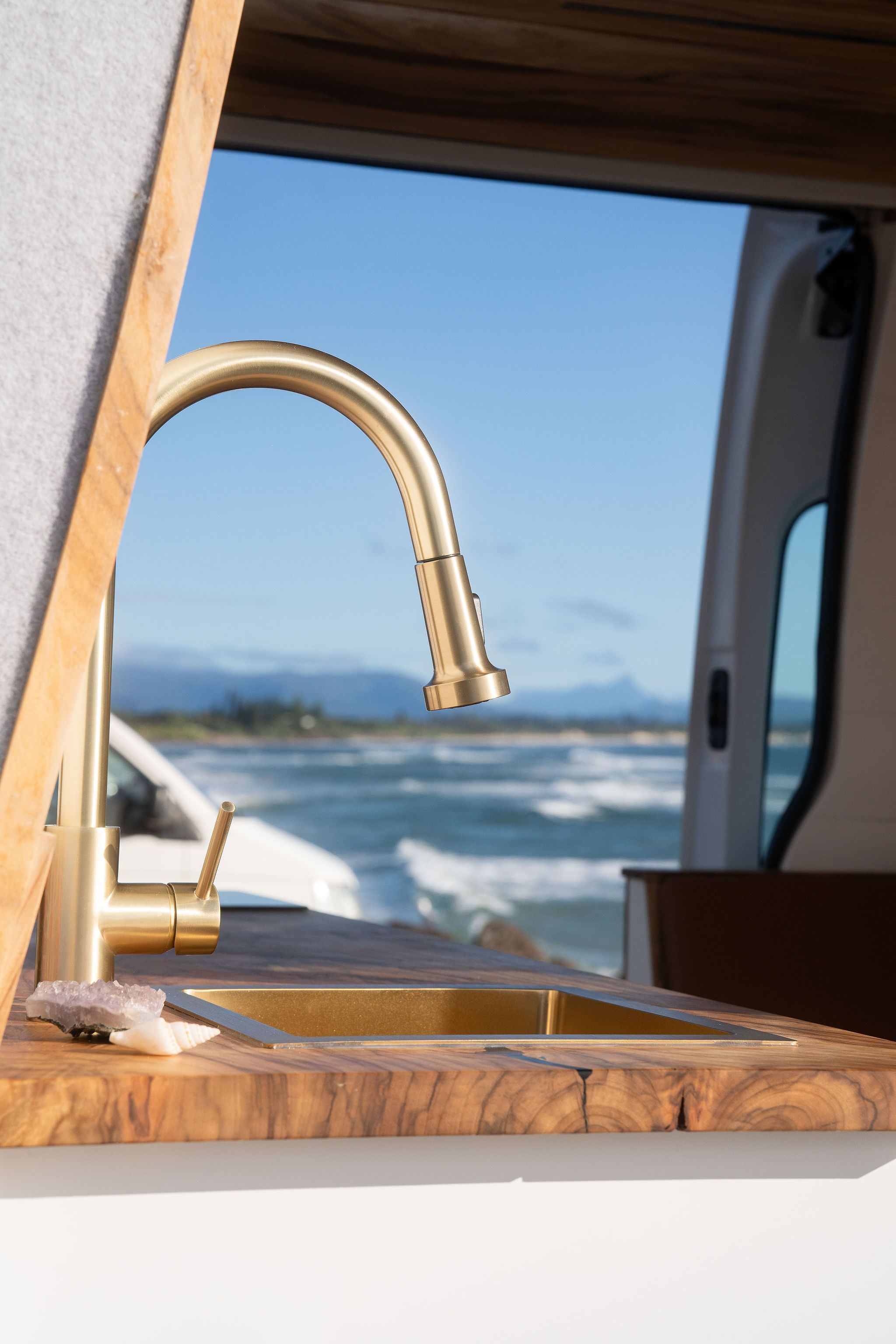 Brass tap and handcrafted benchtop